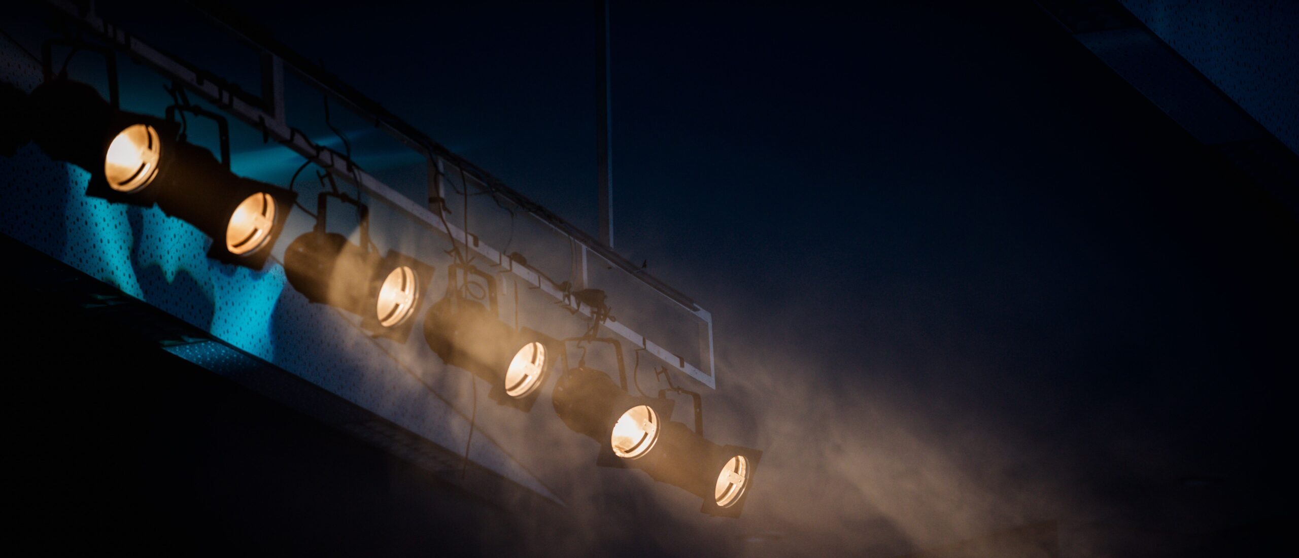 moody stage lighting with smoke effect to add atmospheric drama.