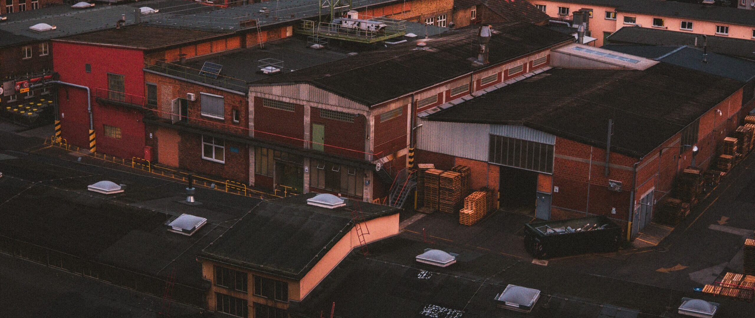 aerial view of industrial buildings in frankfurt am main during sunset, showcasing urban architecture.